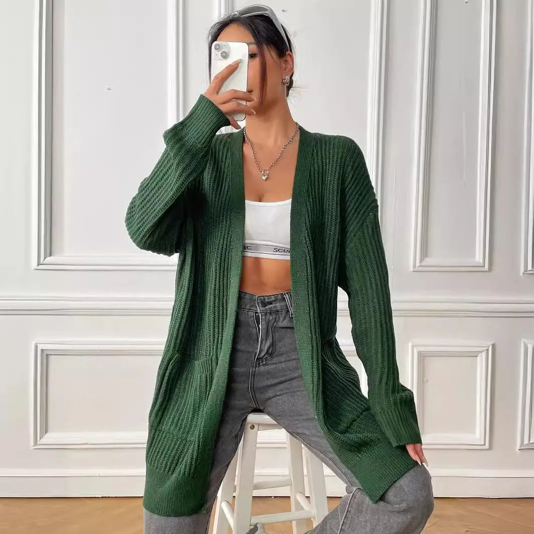 Women's dark green acrylic cardigan sweater with two pockets and long sleeves.