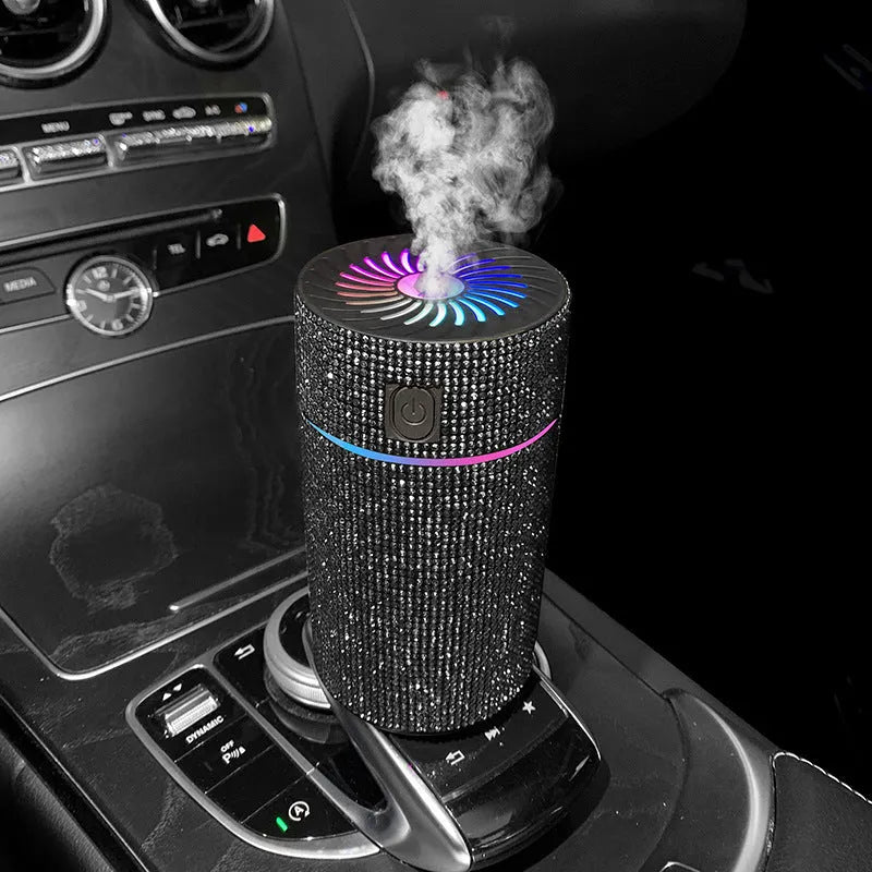 Compact car-mounted air purification humidifier unit on vehicle dashboard with USB power cord
