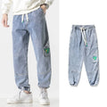 Men's cotton loose fit tapered trousers in black, blue, or grey colours with mid waist design