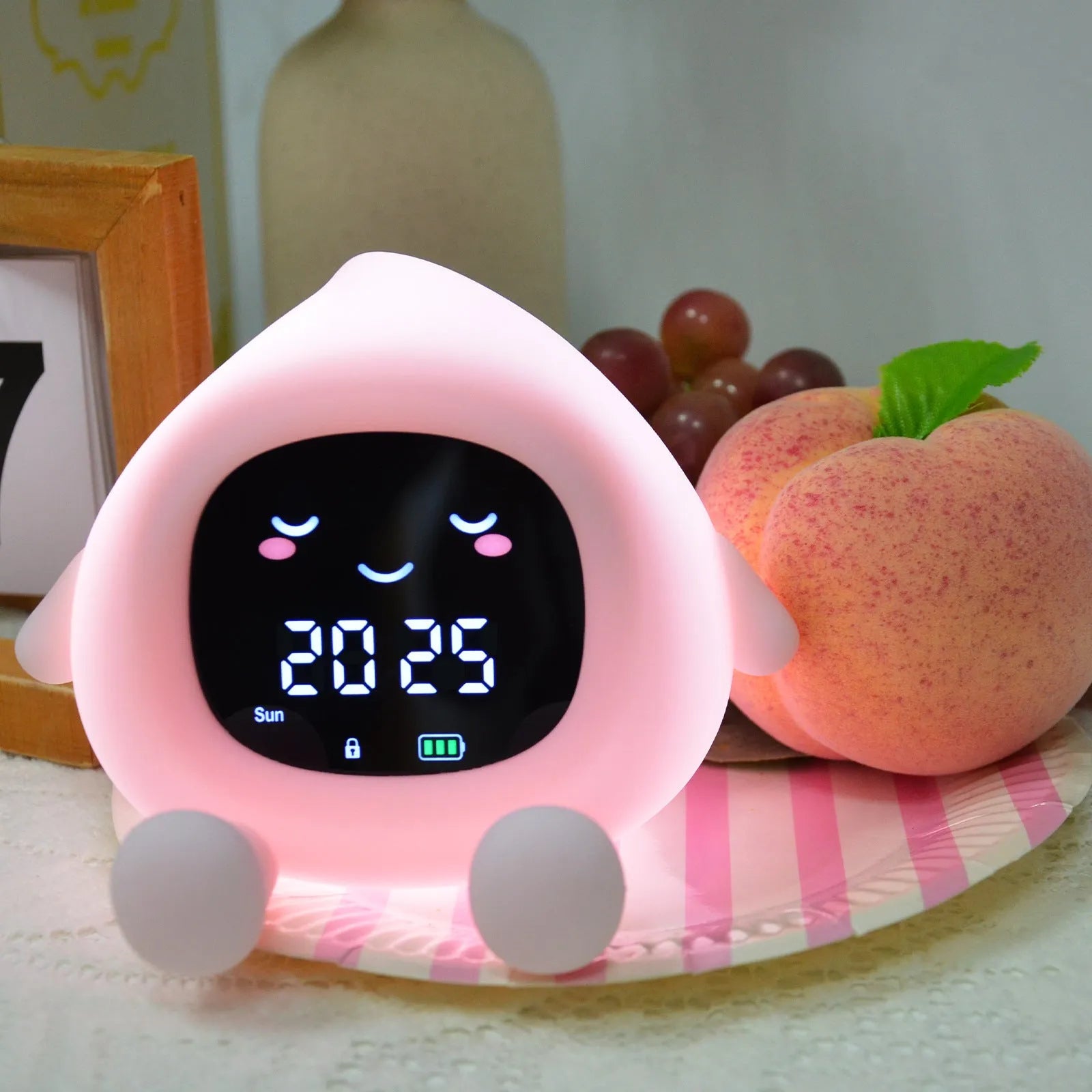 Cartoon lychee alarm clock with white noise and phone holder in silicone shell, over 15mm thick, litchi colour