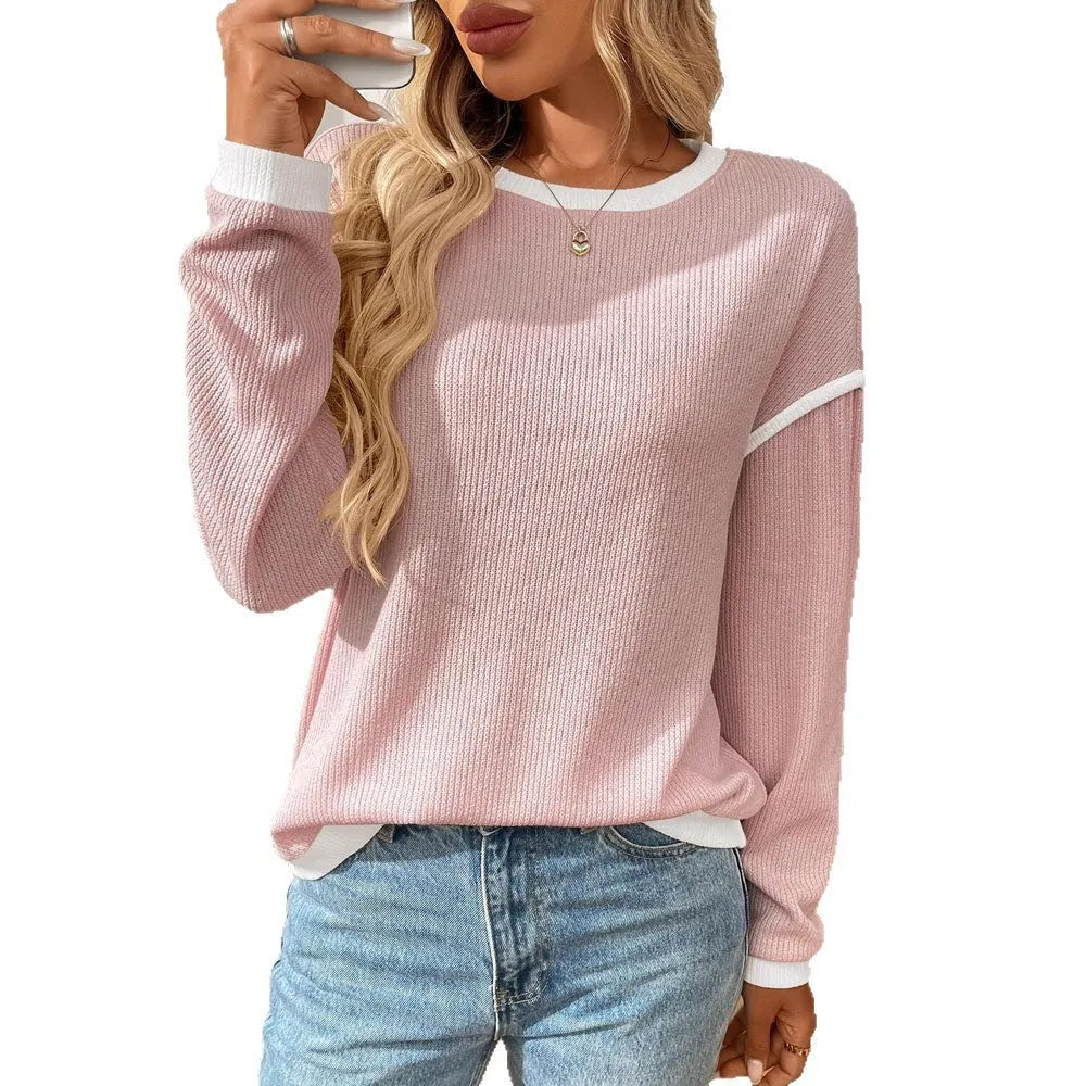 Women's loose fit round neck long sleeve pullover top in light blue polyester fabric.
