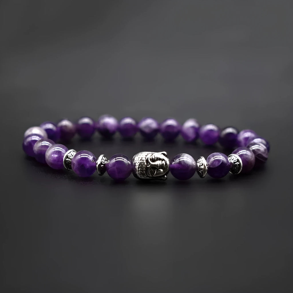 Adjustable unisex bracelet with tiger eye Buddha head charm on a beaded strap.