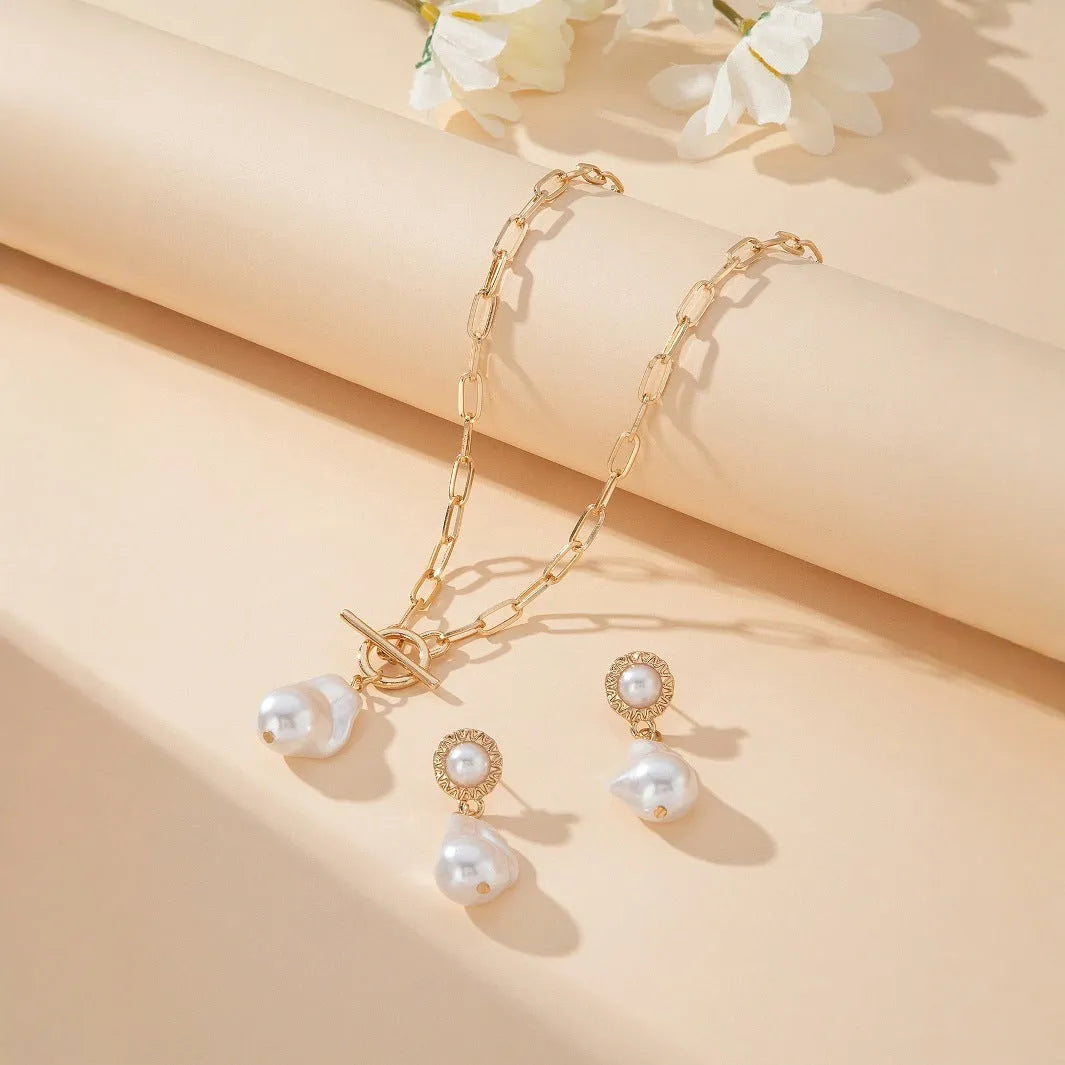 Gold tone retro baroque pearl jewellery set showing necklace and matching earrings