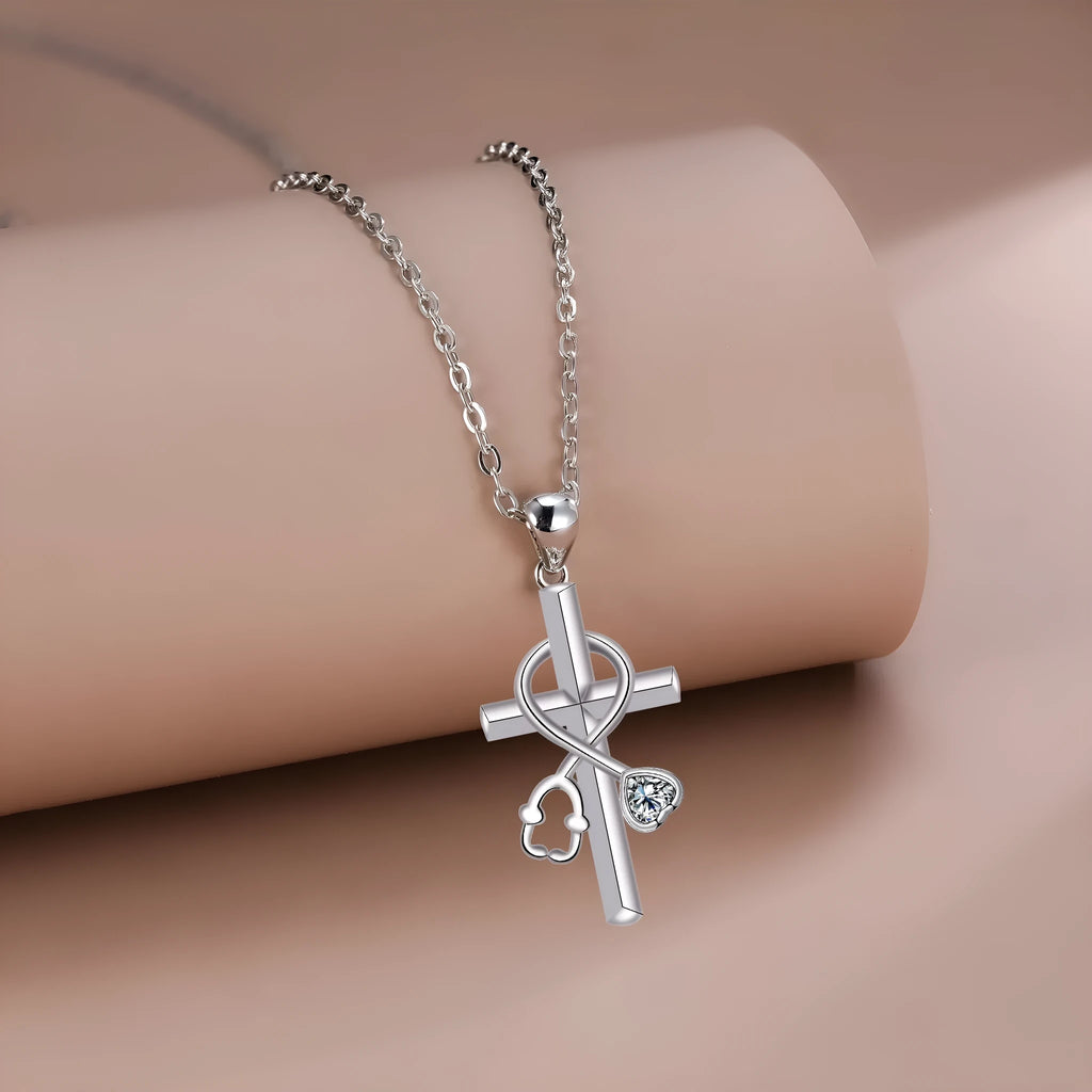Copper cross stethoscope pendant necklace on a cross chain with electroplated finish.