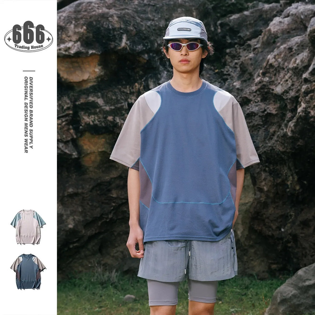Men's loose grey and blue patchwork sports T-shirt with raglan sleeves on a hanger