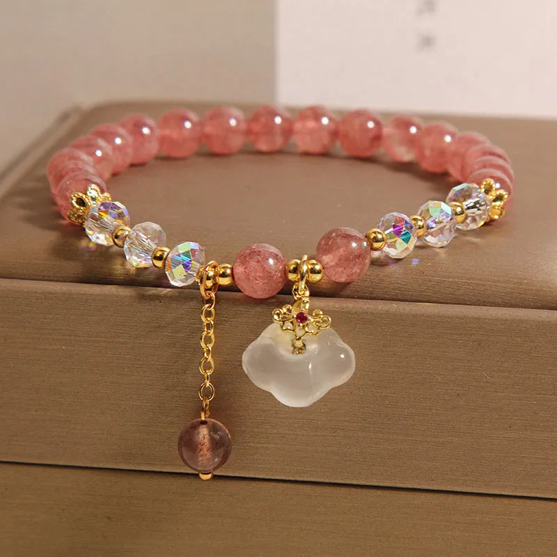 Women's strawberry quartz crystal bracelet with white agate beads and auspicious cloud charms