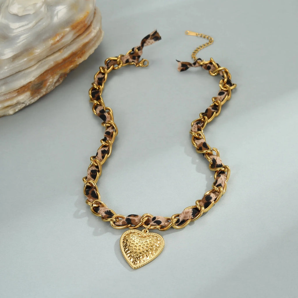 Geometric leopard love design pendant on a stainless steel necklace with an adjustable 41-50cm chain.
