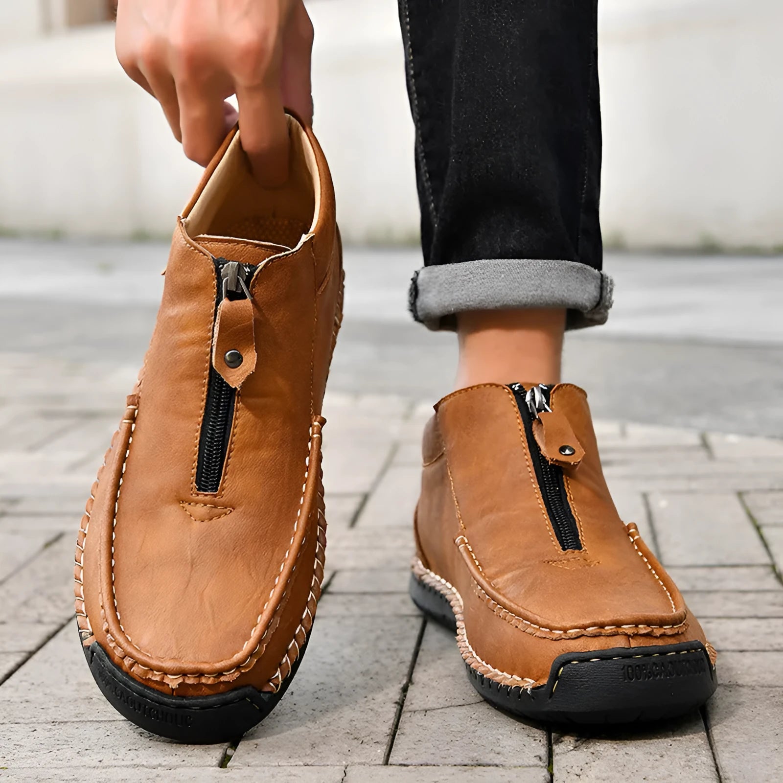 Men's black slip-on casual loafers with a round toe and rubber sole on a white background.