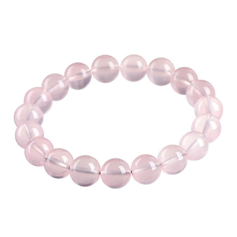Women's crystal bracelet with round polished beads in pink, showing size options from 6mm to 22mm diameter