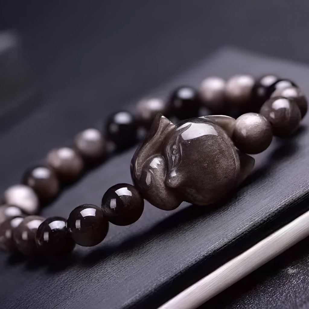 Obsidian bracelet with 8mm fox charm on single ring, polished stone finish