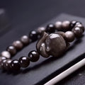 Obsidian bracelet with 8mm fox charm on single ring, polished stone finish