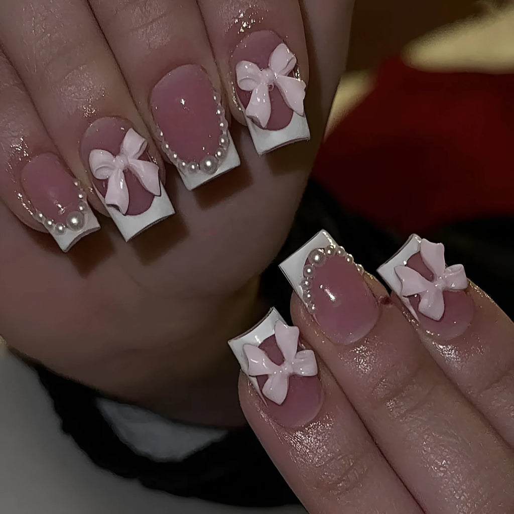 Short white French false nails with cute bow and tulip patterns in sweet style for ladies