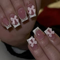 Short white French false nails with cute bow and tulip patterns in sweet style for ladies
