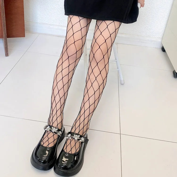 Women's black and white mesh stockings showing large, medium and small net patterns on thin velvet fabric