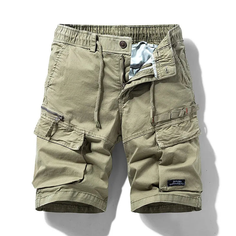 Men's army green cotton shorts with multiple pockets and a zipper, showing Korean summer style.