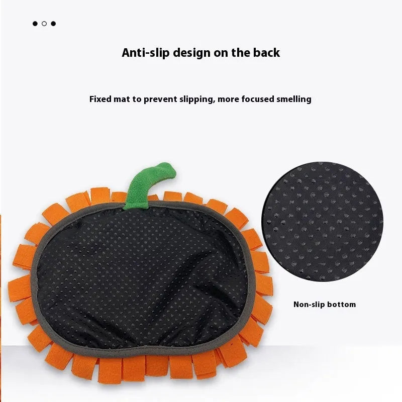 Orange pumpkin-shaped woollen pet training mat on floor with dog treats