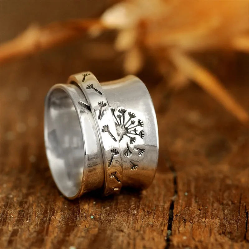 Silver colour alloy flower ring with rotatable design elements showing floral shape in sizes 7-11