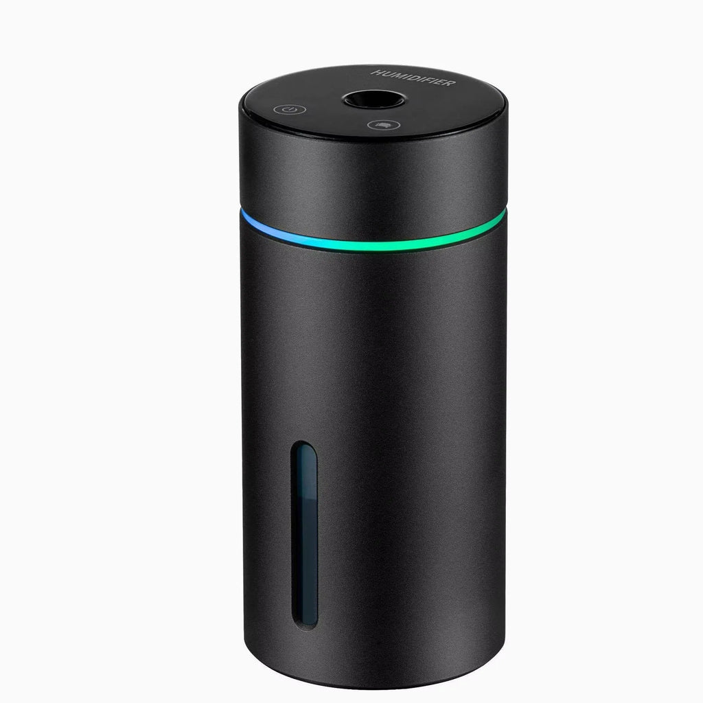 Black portable aluminium car air humidifier and essential oil diffuser with night light on a desk.