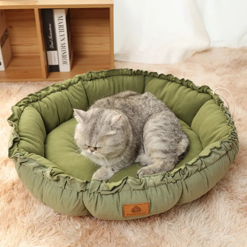 Grey and green reversible donut pet bed for cats and small dogs showing dual sleeping surfaces