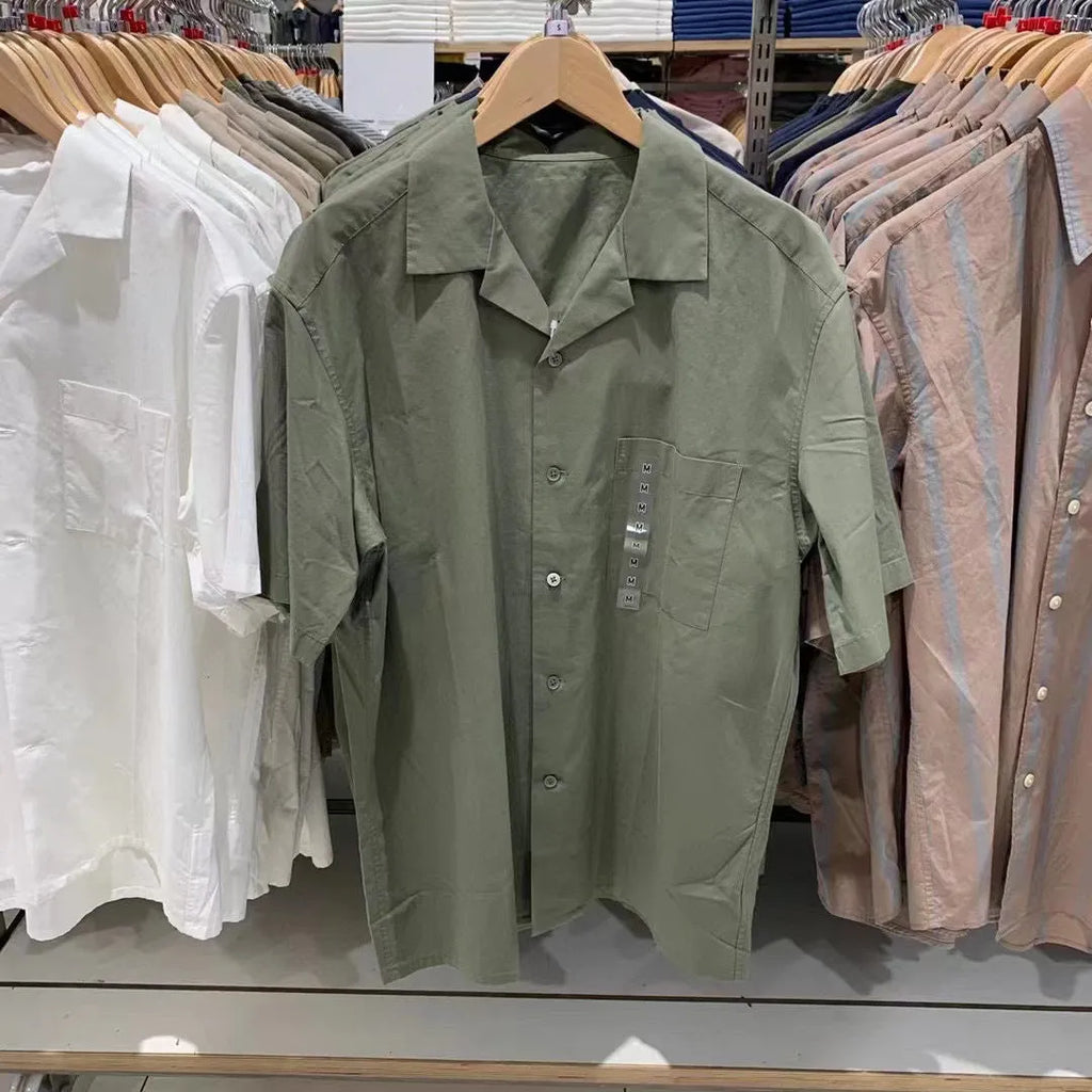 Man wearing a beige open collar modal cotton blend casual shirt with regular sleeves.