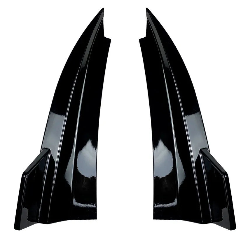 Pair of car rear bumper corner protectors in carbon fibre pattern on a vehicle rear corner