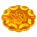Edible silicon anti-choke slow feeding dog bowl in Halloween orange colour on floor