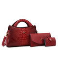 Women's square crossbody handbag in crocodile pattern PU leather, shown in apricot colour with visible strap and pockets.