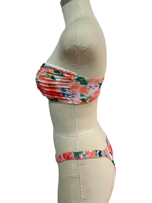 Floral print blue bikini tube top with lace trim and backless design for swimming.