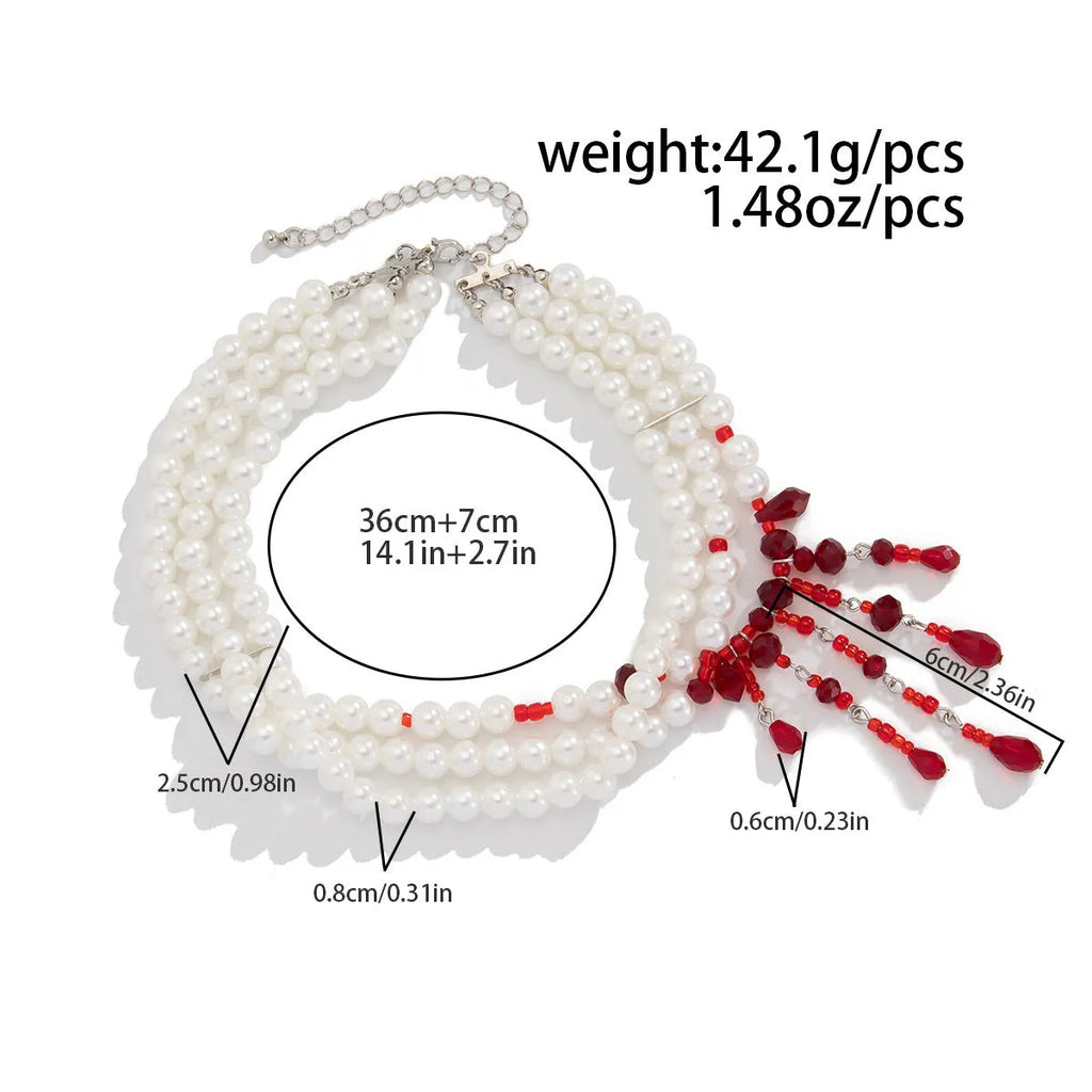 Men's blood drop tassel necklace with geometric crystal pendant and imitation pearls on a chain.