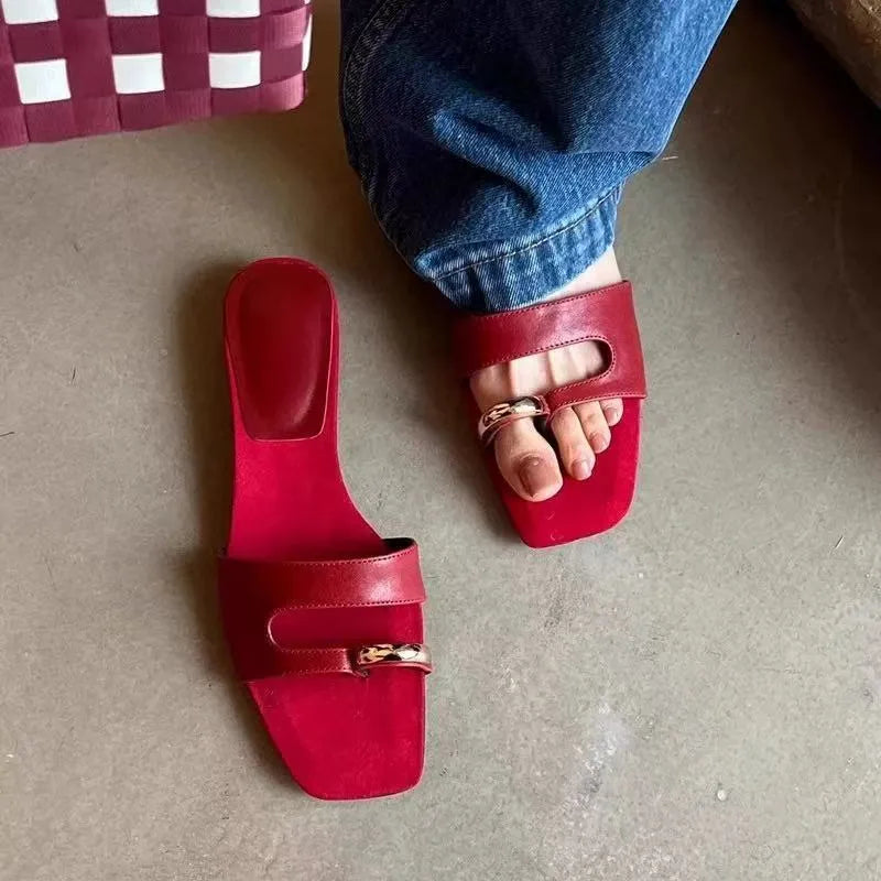 Leather upper outdoor slipper with square scaffolding toe and rubber sole in black, red, silver, and white.