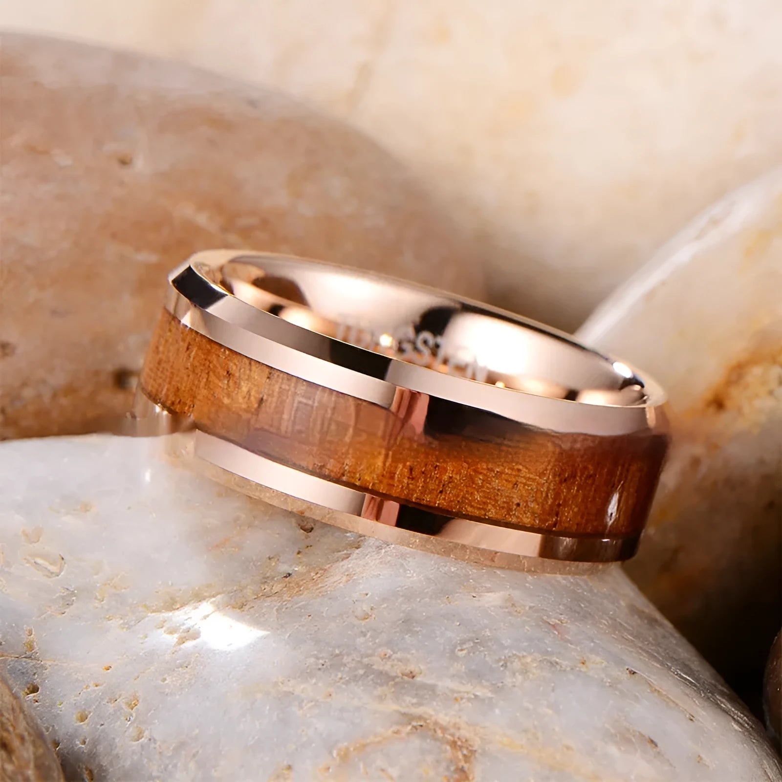 U-shaped men's ring in Ugyen with an 8mm wide band, shown in rose gold and steel colour finishes.