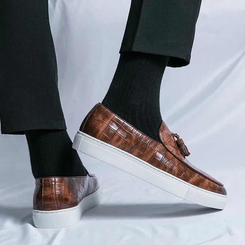 Men's plus size black business casual sneakers with a tassel detail on the PU upper and a rubber sole.