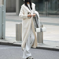 Women's long grey knitted cardigan with hood in trench coat style with regular long sleeves