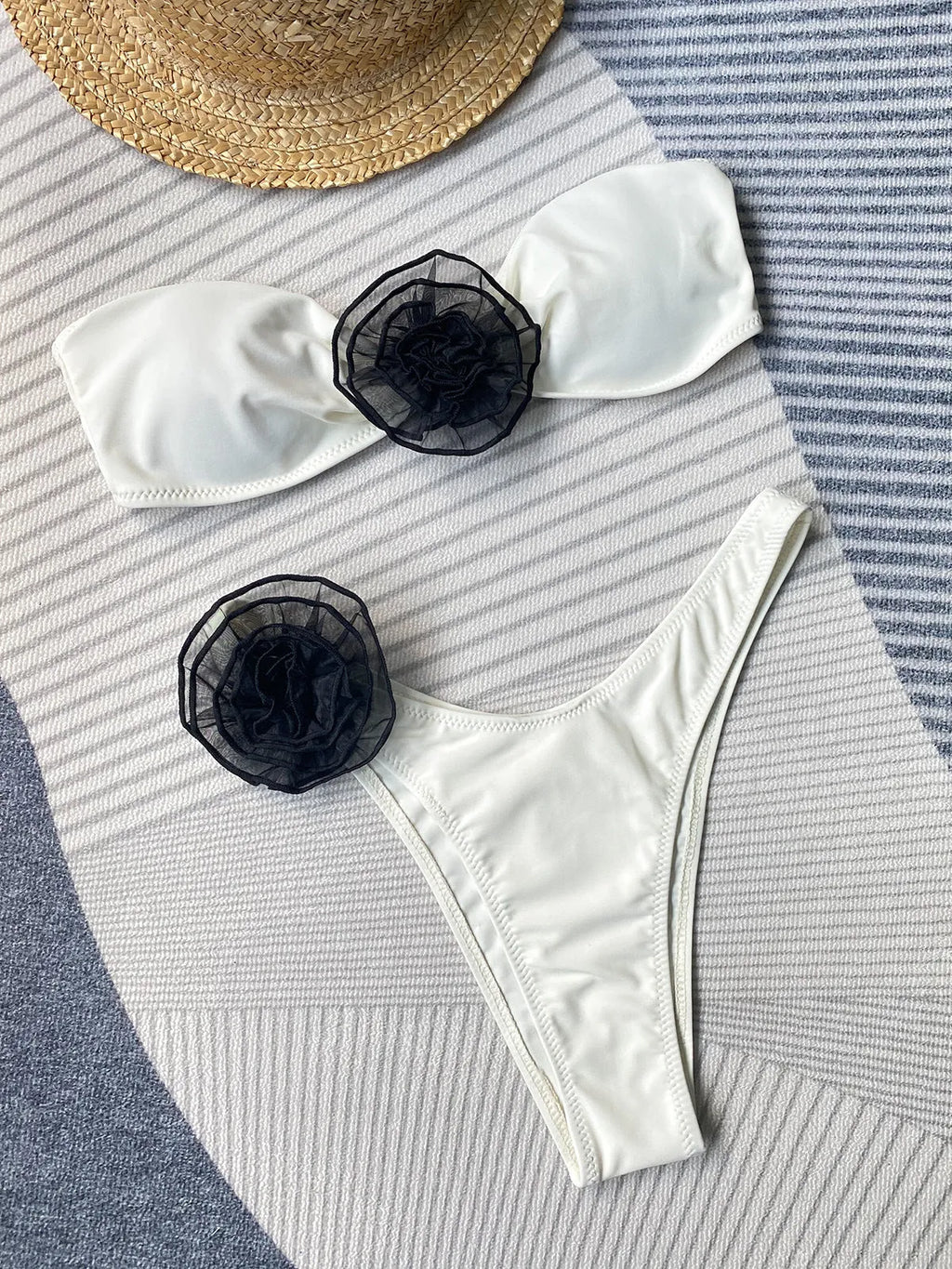 Striped bikini swimsuit with three-dimensional floral split design showing tube top and briefs