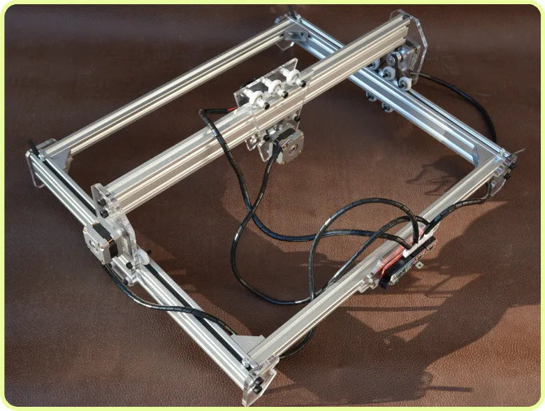Miniature desktop laser engraving machine with a 400mm by 300mm base plate.