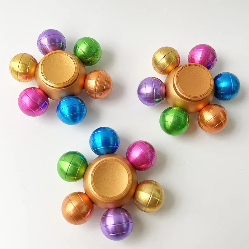 Colourful six Dragon Ball six-bead fingertip gyro in zinc alloy with metal bearing, approximately 6 x 2.2 cm