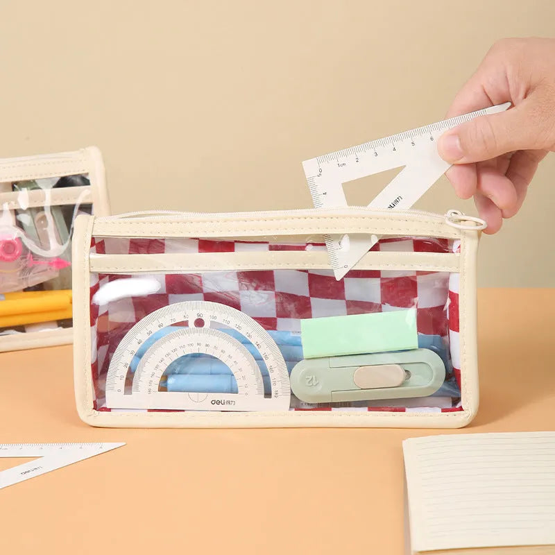 Transparent PVC pencil case with chessboard grid pattern showing pens inside, dimensions 21.5cm x 8cm x 11.5cm
