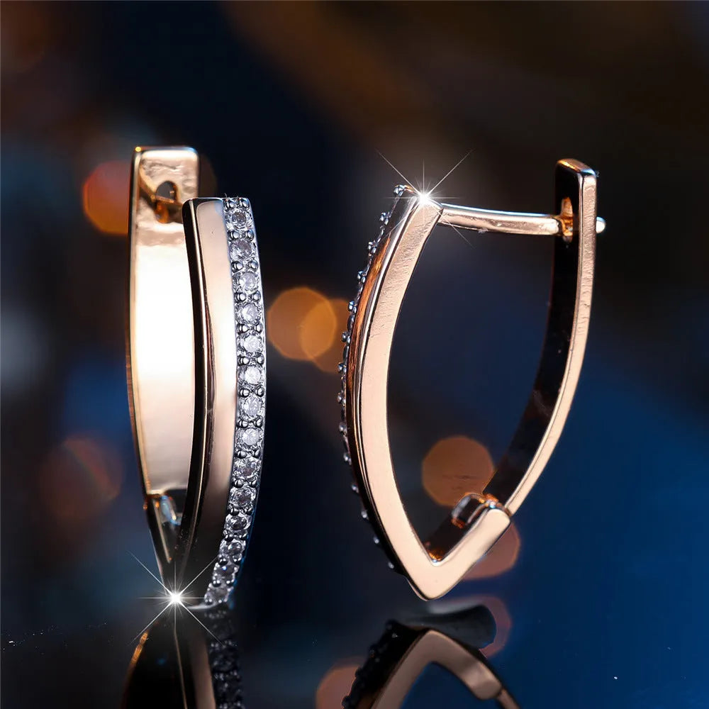 Women's V-shaped geometric earrings in champagne gold white diamond colour with electroplated copper construction