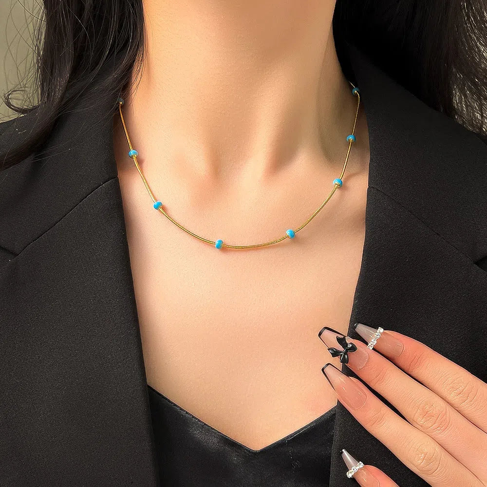 Titanium steel ball drop glaze necklace on stainless steel clavicle chain in Green Pearl Gold