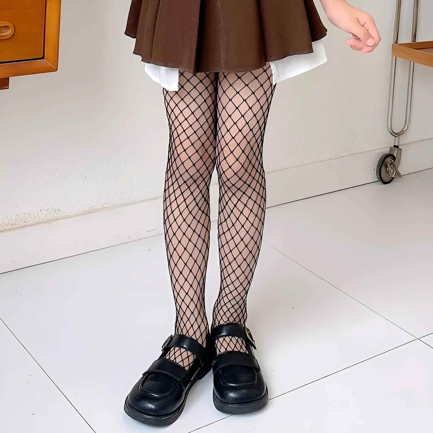 Women's black and white mesh stockings showing large, medium and small net patterns on thin velvet fabric