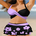 Women's purple high-waisted bikini swimsuit with lace-up detail and skirt