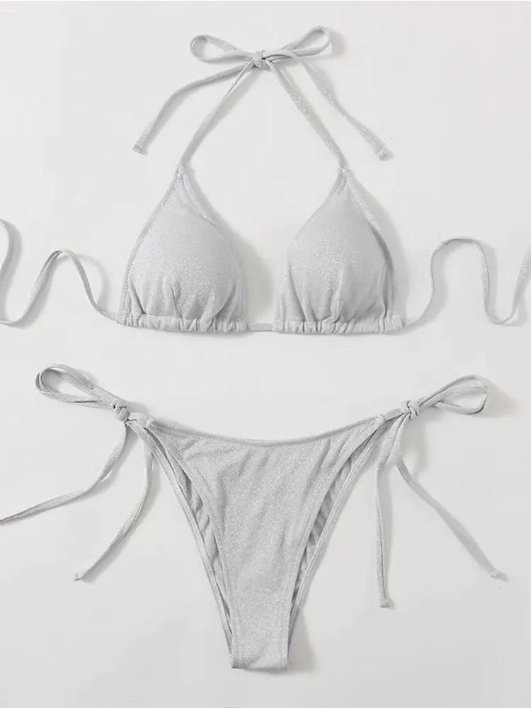 Women's bandage style bikini swimsuit in multiple colours with size chart.