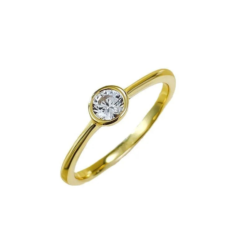 Minimalist crown-shaped silver ring with linear design in electroplated gold or platinum finish.