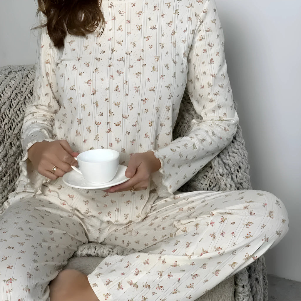 Women's white floral print bell sleeve top and matching wide leg trousers suit set