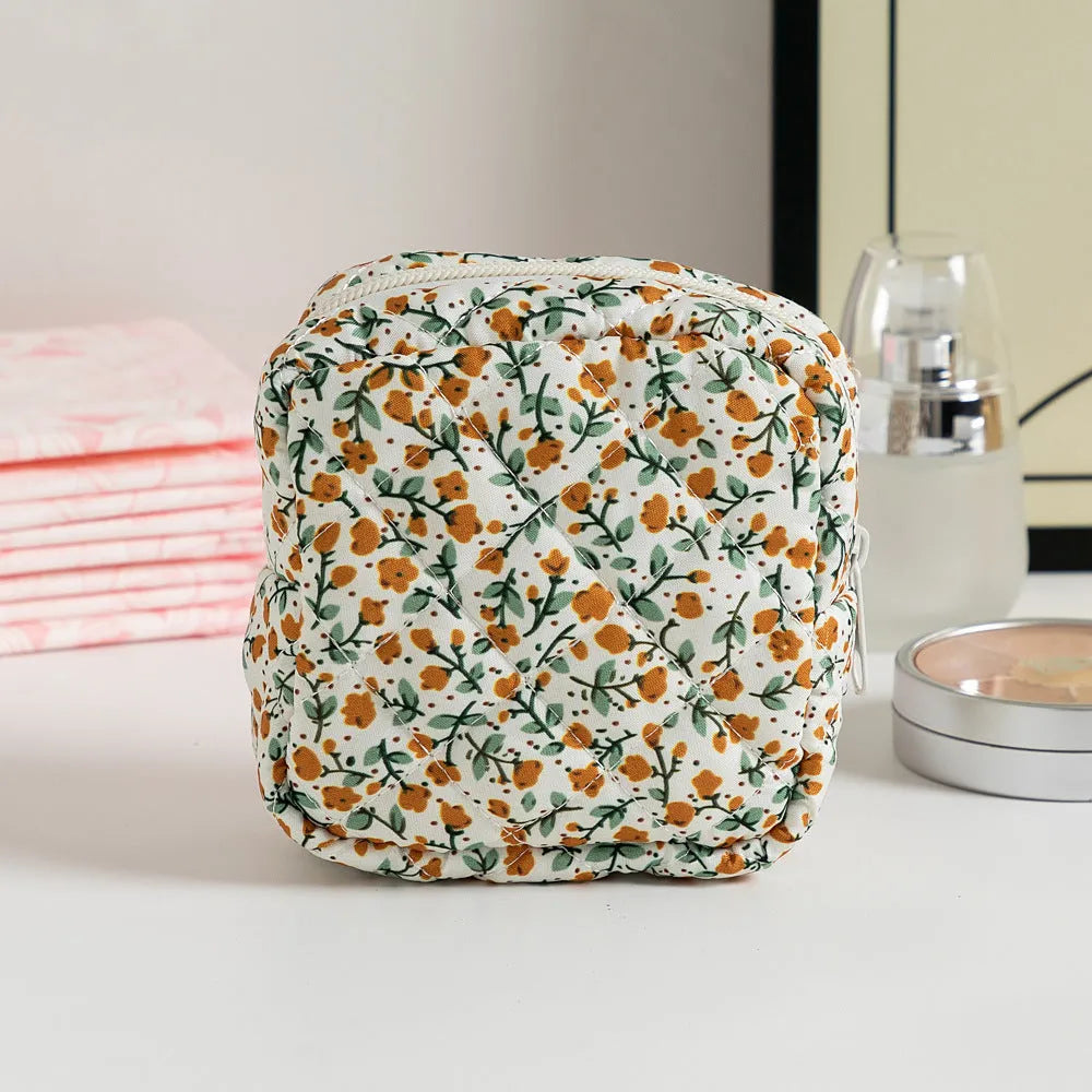 Polyester women's key storage bag with floral pattern choices on white background.