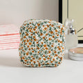 Polyester women's key storage bag with floral pattern choices on white background.