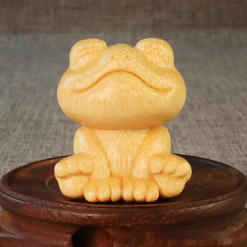 Solid bamboo carving ornament with smiling frog design measuring 5cm tall