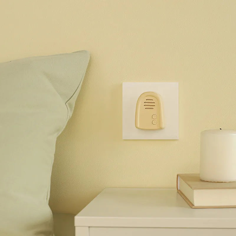 Wireless plug-in doorbell unit in milky yellow or white finish for household use