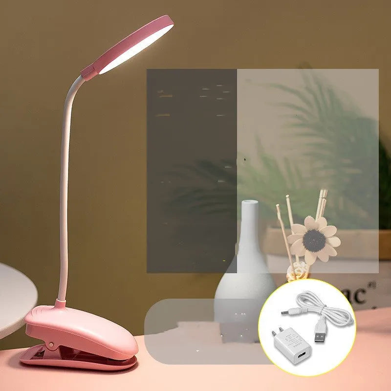 LED clip-on desk lamp with touch dimming, plastic shade, available in white, pink, or green.