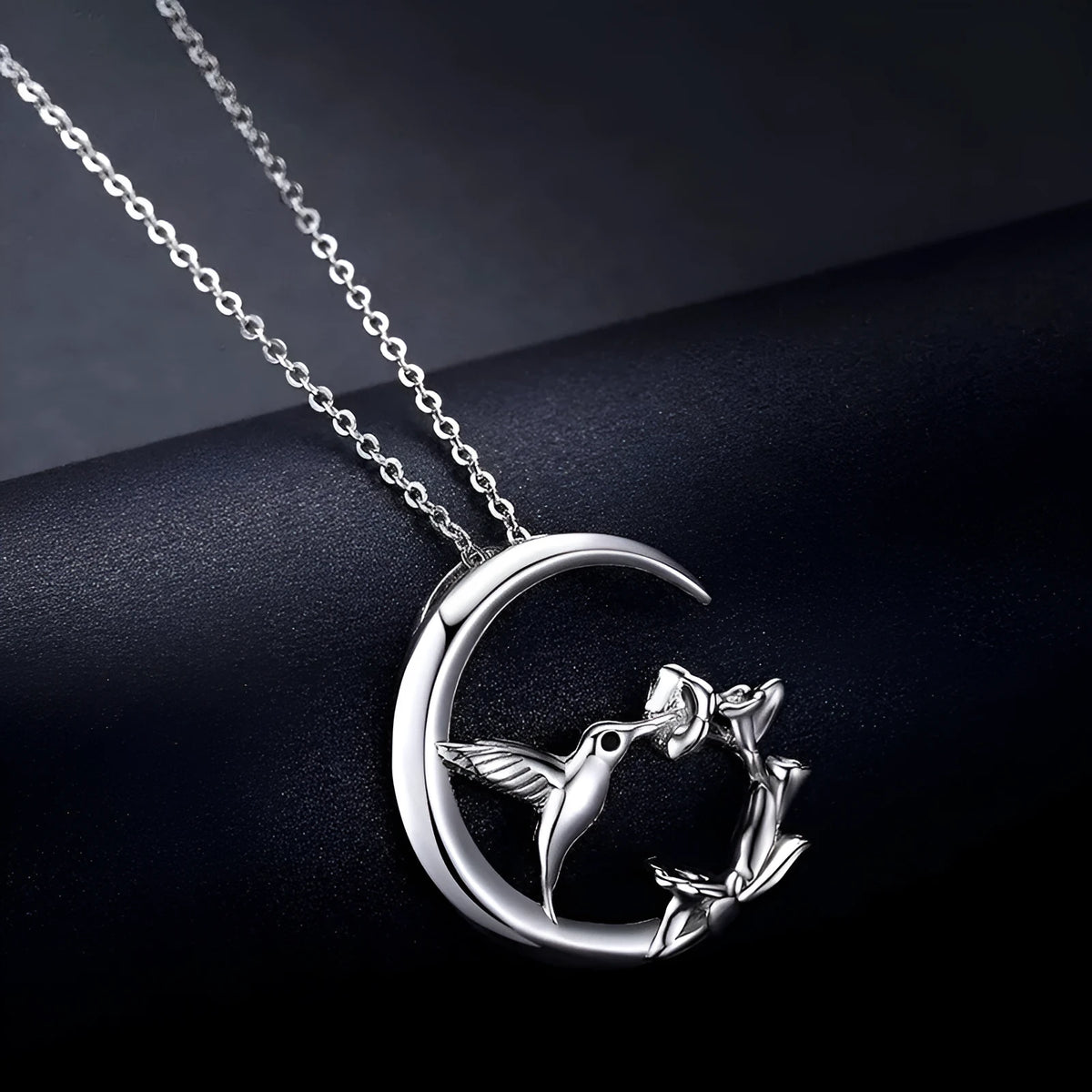 Copper necklace with morning glory blossom and hummingbird pendant in platinum tone on an O-link chain